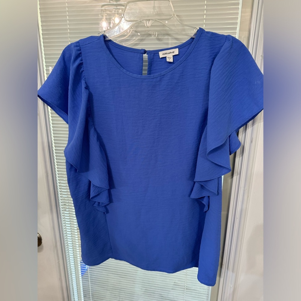 Blue Blouse with flutter sleeves.